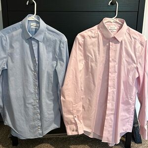 2 Calvin Kline slim fit button down dress shirts.
